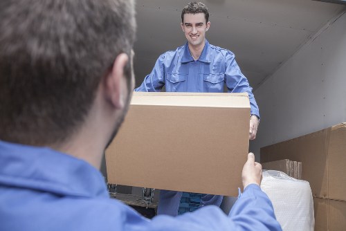 Careful wrapping of fragile items during a Roehampton house move