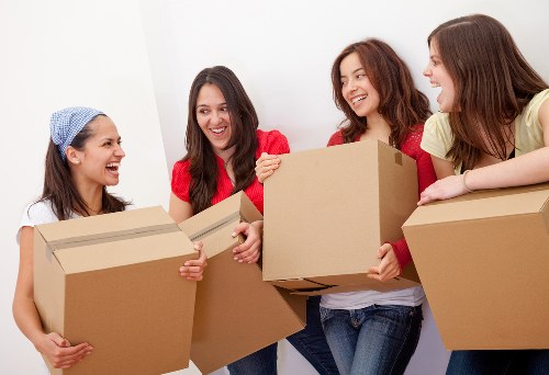 Professional movers handling furniture during same day removals in Roehampton