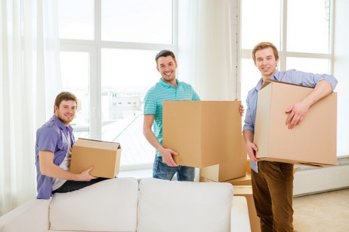 Unpacking boxes and arranging rooms after a move in Roehampton