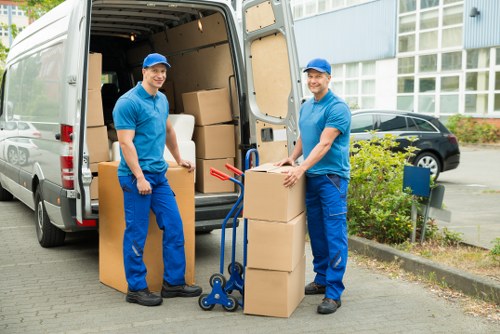 Sustainable moving team separating recyclable items for recovery