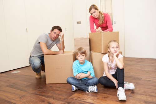 Professional removals team loading furniture in Roehampton