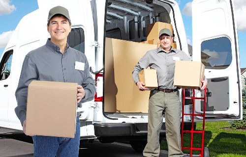 Professional movers packing household items for a Roehampton home move