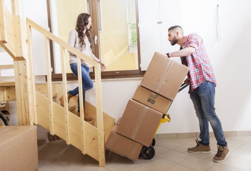 Packed boxes and furniture ready for local removal in Roehampton